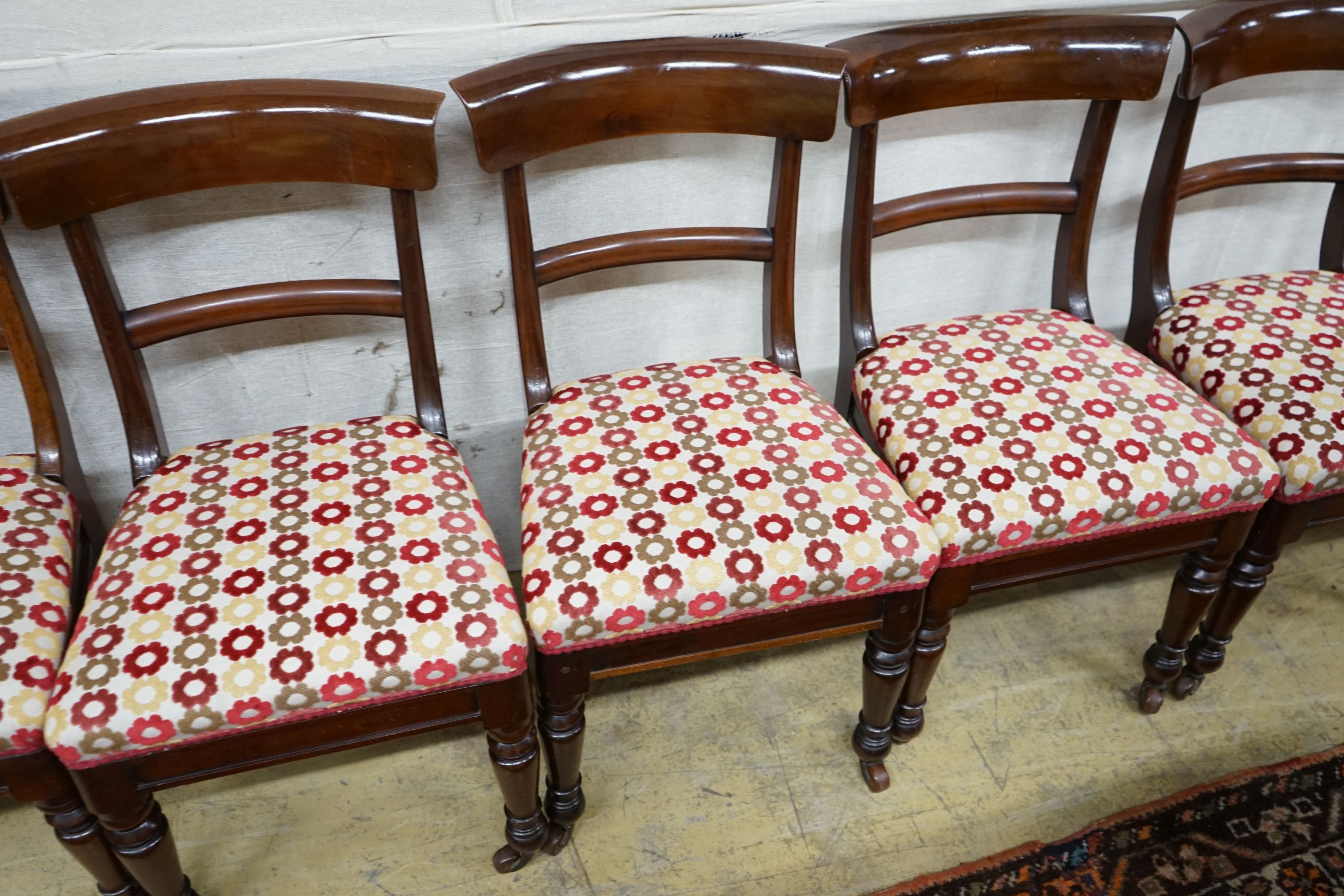 A set of eight mid Victorian mahogany dining chairs